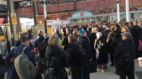 Passengers at Norwich railway station after a train cancellation