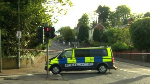 police car at end of the road