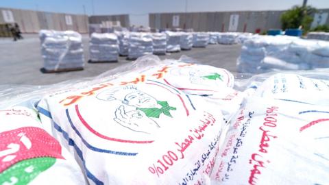 Sacks of rice are seen waiting to cross into Gaza