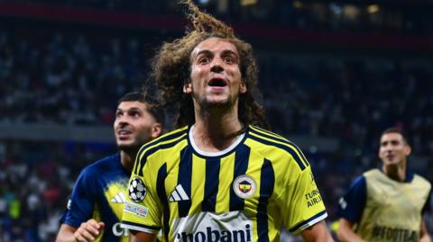Matteo Guendouzi of Fenerbahce celebrates at the end of the UEFA Champions League playoff round second-leg match between Olympique Lyon and Fenerbahce at Groupama Stadium in Lyon,