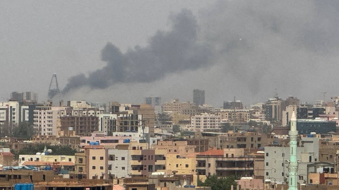 Plumes of smoke rise during clashes between the paramilitary Rapid Support Forces and the army in Khartoum on 26 September 2024