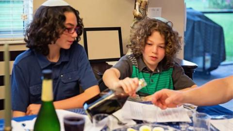 Two young boys celebrate Passover