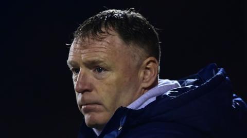 Graham Coughlan looks on from the touchline