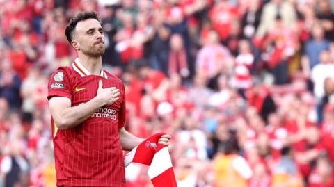 Diogo Jota of Liverpool acknowledges the crowd after a Premier League match.
