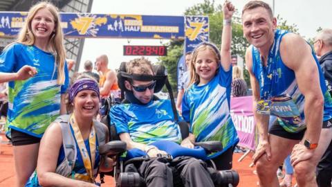 Rob Burrow alongside wife Lindsey (who ran the half marathon), daughters Macy and Maya and Kevin Sinfield who ran the full marathon all pose for a picture after the Rob Burrow Leeds Marathon in 2024