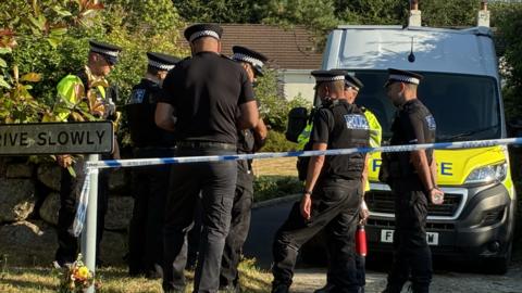 Police outside Ann Widdecombe's home.