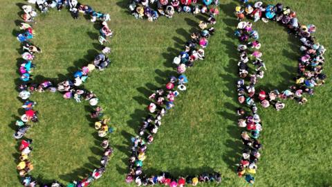 Hundreds of people marking the letters BZP