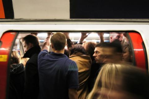 People getting on a tube train 