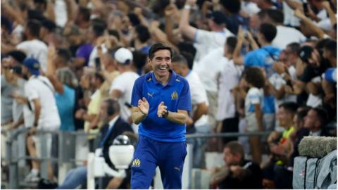 Marcelino smiles after a Marseille goal