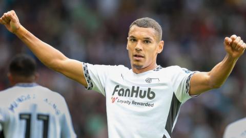 Derby County's Kayden Jackson has both fists in the air as he celebrates a goal