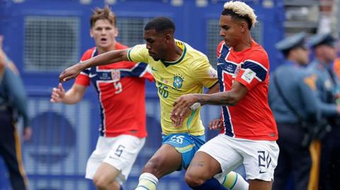 Rayan running with the ball for Brazil