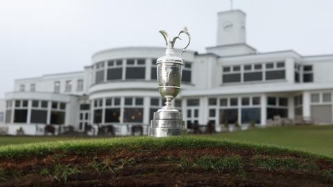 The Claret Jug photographed on top of a bunker in front of the Royal Birkdale clubhouse