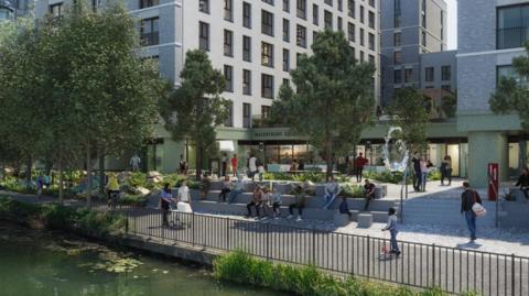 A CGI image shows people enjoying the new communal area by the riverside on a sunny day. There are mothers with children, professionals and other visitors walking and sitting around. One child is pictured on a scooter, a woman is riding a bike. The building's name Waterfront Square can be seen through the trees in front of it. 