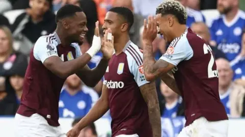Jhon Duran celebrates with his team-mates after putting Aston Villa 2-0 up against Leicester City