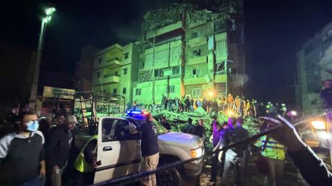 People gather at the site of an Israeli airstrike that targeted Beirut's southern suburbs Haret Hreik neighborhood on May 6, 2026