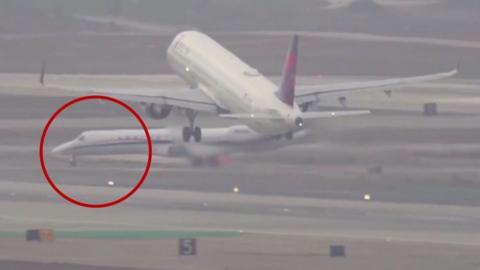 A jet is circled in red close to a commercial plane. 