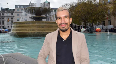 Frank Ospina in front of a fountain in Trafalgar Square