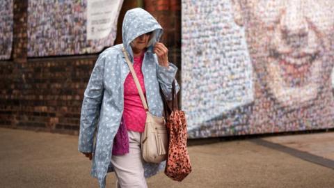 Woman walking in the rain