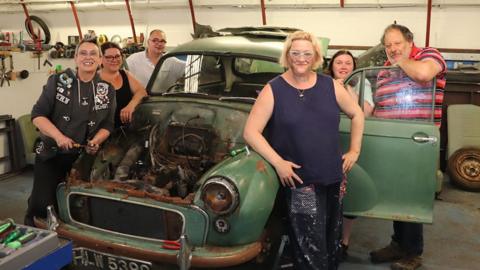 Participants with rusty car