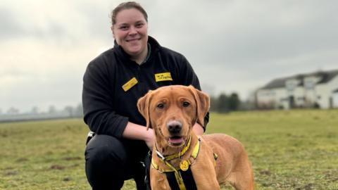 Olympic shot putter Sophie McKinna with a rescue dog