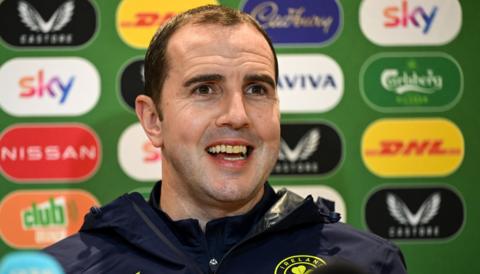 John O'Shea speaking to reporters in Dublin on Monday