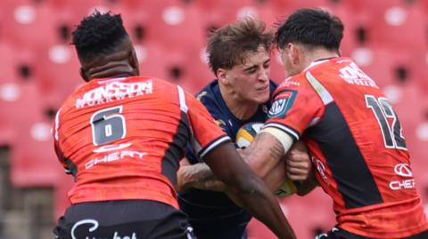Huw Anderson carries the ball for Dragons at Lions