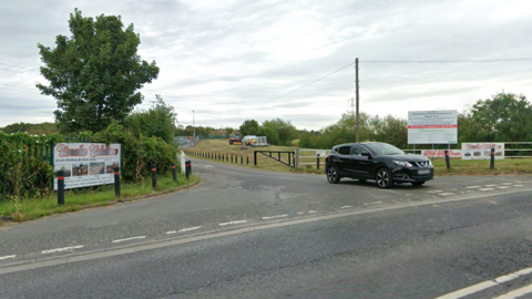 Google image of the road in Doncaster outside Uncle Eddie's Motor Track showing cars and the entrance to the track.