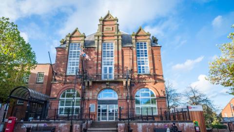 Amber Valley Borough Council's office. It is a grand red brick building.