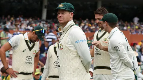 Australia cricket player Steve Smith alongside teammates