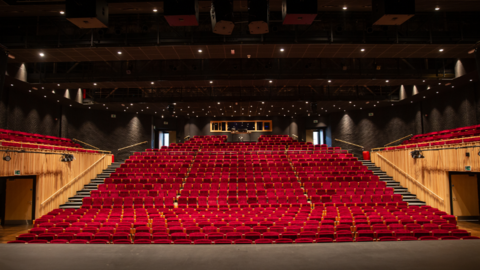 Stage view of the auditorium, of 800 red empty seats.