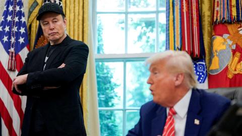 Elon Musk and President Donald Trump next to each other in the White House in the United States of America. 