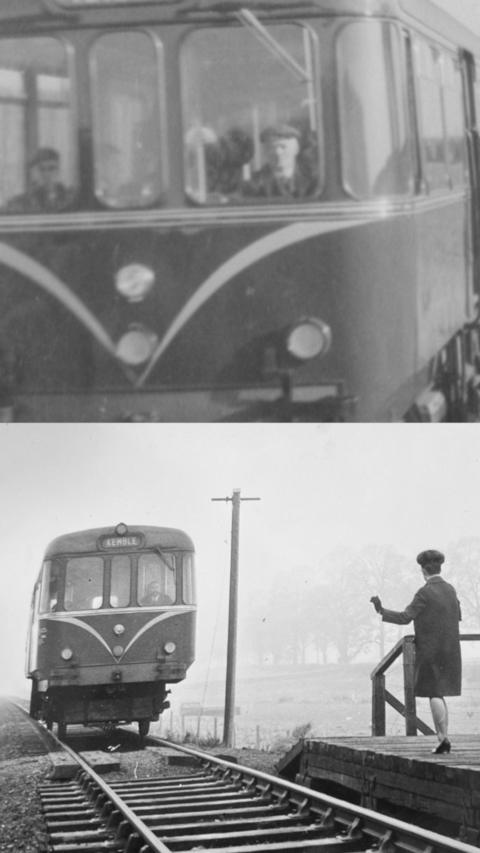 Black and white image of a railbus pulling into a platform.