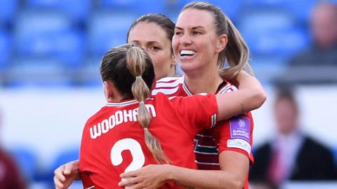 Gemma Evans of Wales celebrates scoring with Lily Woodham