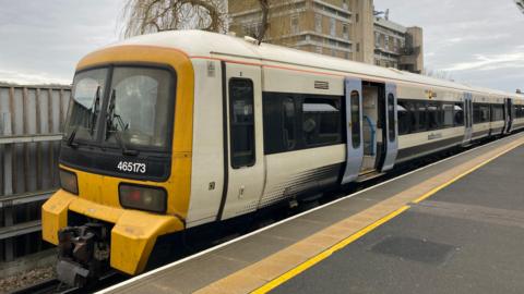 A Southeastern train at a platform, with doors open