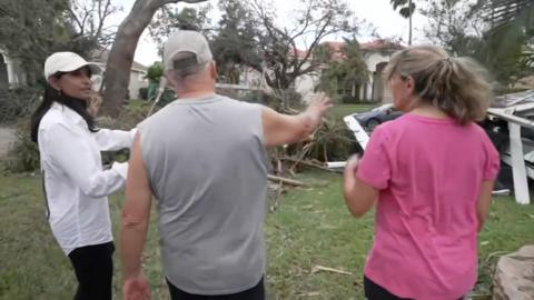 Sumi Somaskanda speaking with Wellington residents after a tornado