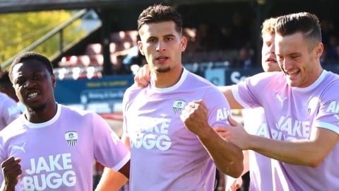 Ruben Rodrigues (centre) celebrates a goal for Notts County