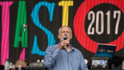 Jeremy Corbyn addresses the crowd from the Pyramid Stage at Glastonbury