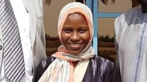 Zainab Aliyu (C) pictured with Nigerian officials in Jeddah shortly after her release from prison