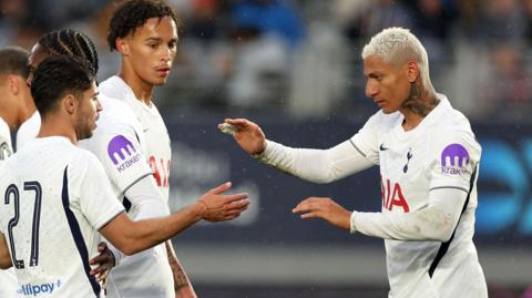 Tottenham's Richarlison celebrates his goal against Auckland FC with his team-mates 