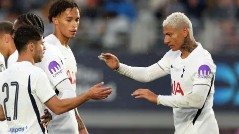 Tottenham's Richarlison celebrates his goal against Auckland FC with his team-mates 