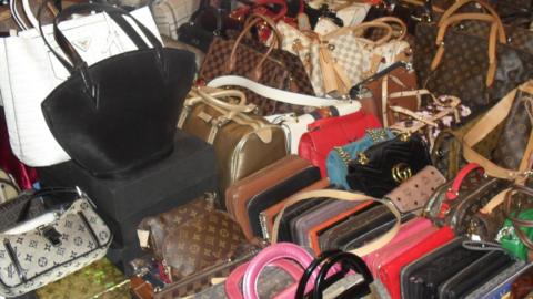 A large selection of bags which at first glance look to be designer brands