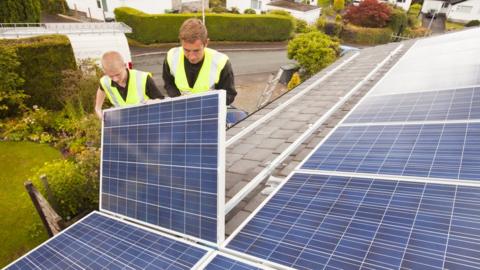 Solar panels being installed