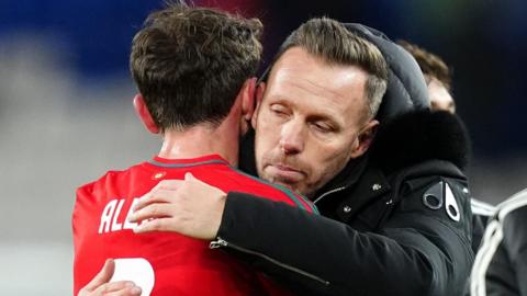 Wales boss Craig Bellamy hugs Joe Allen