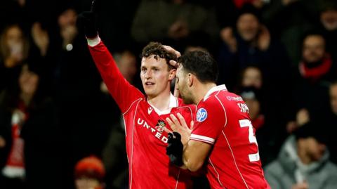 Wrexham's Nathan Broadhead (left) celebrates with Matty James