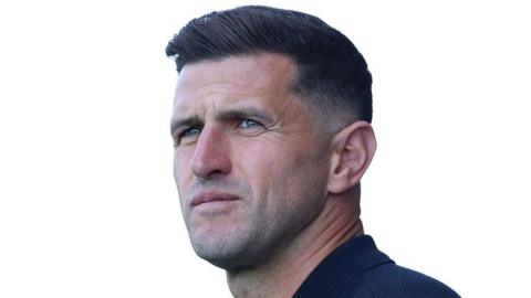 John Mousinho looks on at Kassam Stadium Oxford 