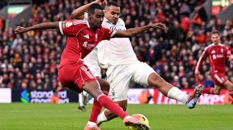 Alexander Isak of Liverpool and Murillo of Nottingham Forest battle for the ball