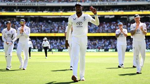 England's Jofra Archer holds up the ball