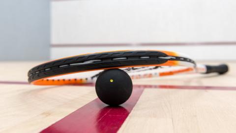 Squash ball on court