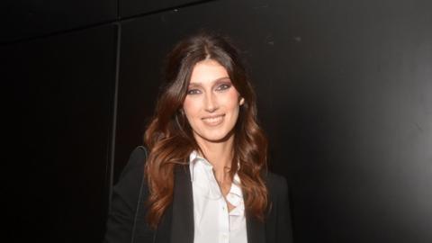 Sophie Vouzelaud with long auburn hair and wearing a white short and black jacket in Paris, France, in October 2023.