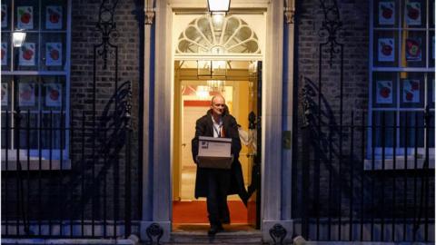 Dominic Cummings exits No 10 Downing Street carrying a cardboard box in November 2020